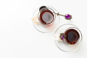 Turkish tea in traditional glass isolated on white background photo