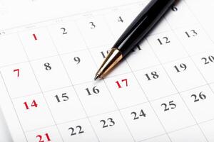 Check out the dates in a business calendar concept photo