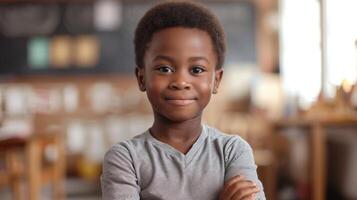 Portrait of cute African-American boy looking at camera in cafe photo