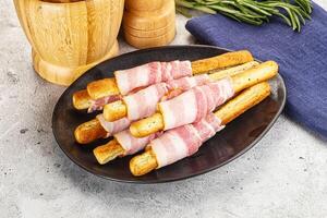Crispy grissini italian bread with bacon photo