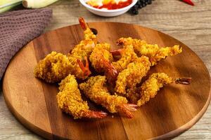 Golden deep prawn tempura wuth sauce photo