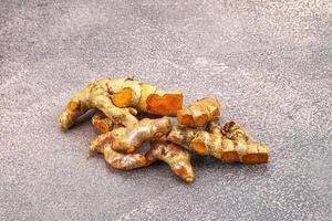 Fresh young Tumeric root heap photo