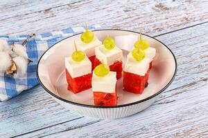 Watermelon with feta and grape photo
