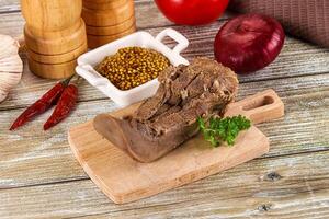 Steamed pork tongue with mustard photo
