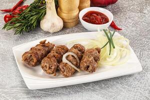 Beef kebab minced meat with onion photo