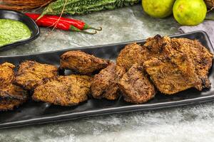 Grilled beef barbecue with spises photo