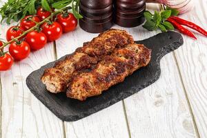 Chicken kebab minced meat and spices photo