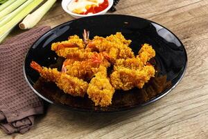 Golden deep prawn tempura wuth sauce photo