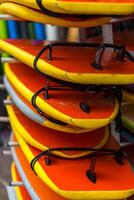 Surf boards in a stack photo