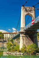 Old Passerelle du College bridge over Rhone river in Lyon, France photo
