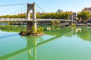 Old Passerelle du College bridge over Rhone river in Lyon, France photo