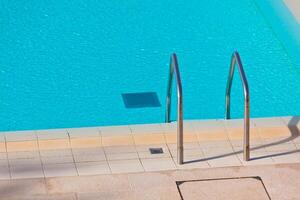 Ladder of a swimming pool photo