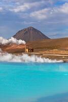 Geothermal Power Station and Turquoise Lake in Iceland photo