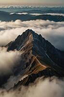 A mountain covered in clouds and fog photo