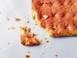 Biscuits flavoured with abon sapi or shredded beef, namely dried beef flakes, isolated on a white background. photo