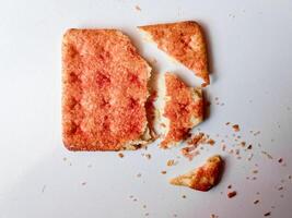Biscuits flavoured with abon sapi or shredded beef, namely dried beef flakes, isolated on a white background. photo