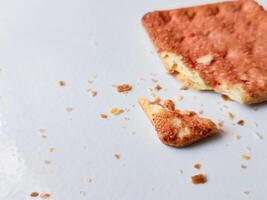 Biscuits flavoured with abon sapi or shredded beef, namely dried beef flakes, isolated on a white background. photo