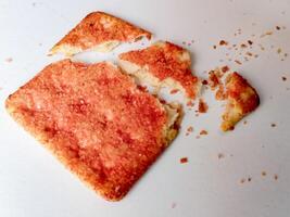 Biscuits flavoured with abon sapi or shredded beef, namely dried beef flakes, isolated on a white background. photo