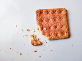Biscuits flavoured with abon sapi or shredded beef, namely dried beef flakes, isolated on a white background. photo