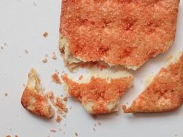 Biscuits flavoured with abon sapi or shredded beef, namely dried beef flakes, isolated on a white background. photo