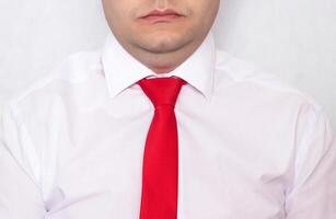 Office worker caucasian man with overweight in a tie with a problematic double chin on a white background, diet photo