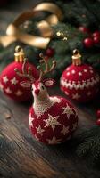 Three red knitted christmas balls with a deer on top photo