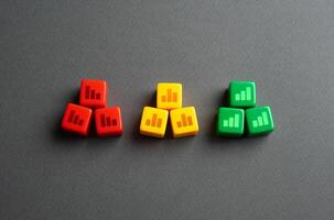 Bad, neutral and good economic indicators. Concept of various business cases. Successful and unsuccessful examples. Business models. Red, yellow and green blocks with graphs. photo