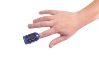 Oximeter on the finger of a person on a white background. Concept for measuring pulse and lung saturation with covid 19, isolate photo