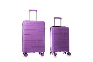 Set of polypropylene purple suitcases on a white background, isolate, close-up photo
