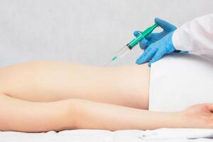 The doctor makes an injection of ozone and chondroprotector in the spine to the patient, ozone therapy, inflammation photo