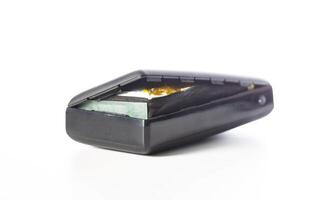 Bloated black power bank on a white background, isolate. Danger of power bank explosion, close-up photo