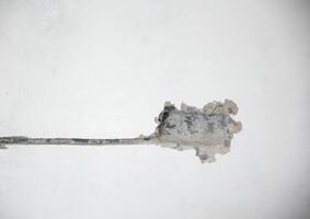 A hole in a concrete wall for installing new sockets during renovations in an apartment. Copy space for text photo