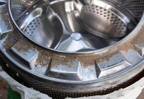 Disassembling the washing machine drum to replace the cross. Washing machine breakdown and repair, close-up photo
