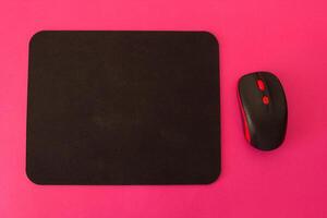 Computer mouse and mouse on a pink background photo