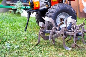cutters complete with walk-behind tractor for work on the ground. Technique for agriculture. Motor cultivator. Copy space for text photo