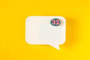 Symbol sign message from a white paper on a yellow background, social network, message, symbol photo