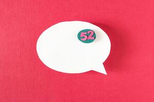 Symbol sign message from a white paper on a red background, social network, message, symbol photo