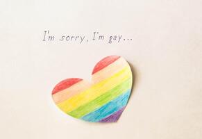 Inscription on white background I'm sorry gay and heart in the form of a flag of lgbt, homosexuality photo