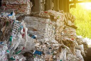 Pressed rubbish for further processing, sorting and processing of garbage and the sun photo