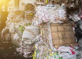 Pressed rubbish for further processing, sorting and processing of garbage, the sun photo