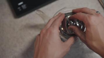 Pov view how Man putting tea bag in teapot with lemon video