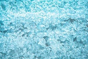 frost texture. frozen ice on the grass. winter hoarfrost background photo