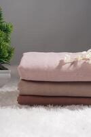 Pile of hijabs in soft colors isolated on a white background. Hijab mockup and high resolution photos. photo