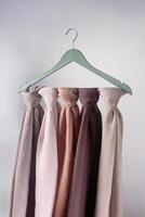 A soft colored hijab hanging in isolated on a white background. Hijab mockup and high resolution photos. photo