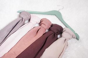A soft colored hijab hanging in isolated on a white background. Hijab mockup and high resolution photos. photo