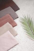 Pile of hijabs in soft colors isolated on a white background. Hijab mockup and high resolution photos. photo