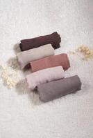A rolled hijab in soft colors isolated on a white background. Hijab mockup and high resolution photos. photo