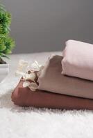 Pile of hijabs in soft colors isolated on a white background. Hijab mockup and high resolution photos. photo