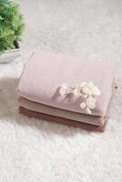 Pile of hijabs in soft colors isolated on a white background. Hijab mockup and high resolution photos. photo