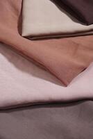 Pile of hijabs in soft colors isolated on a white background. Hijab mockup and high resolution photos. photo